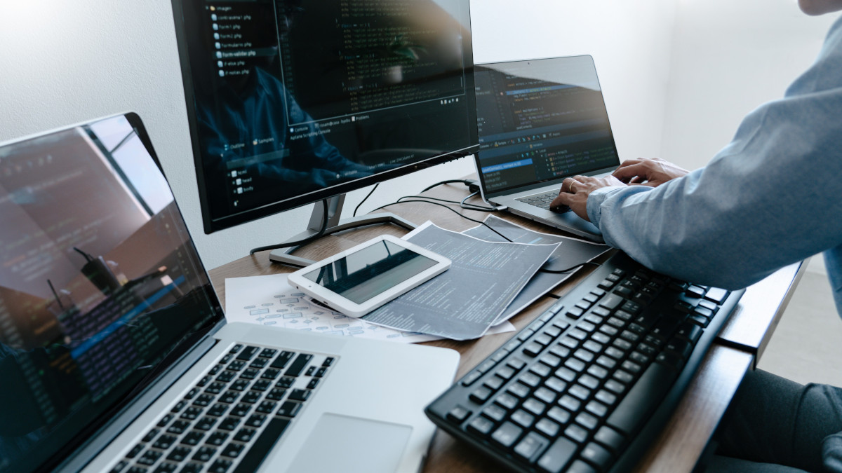 A programmer working with code